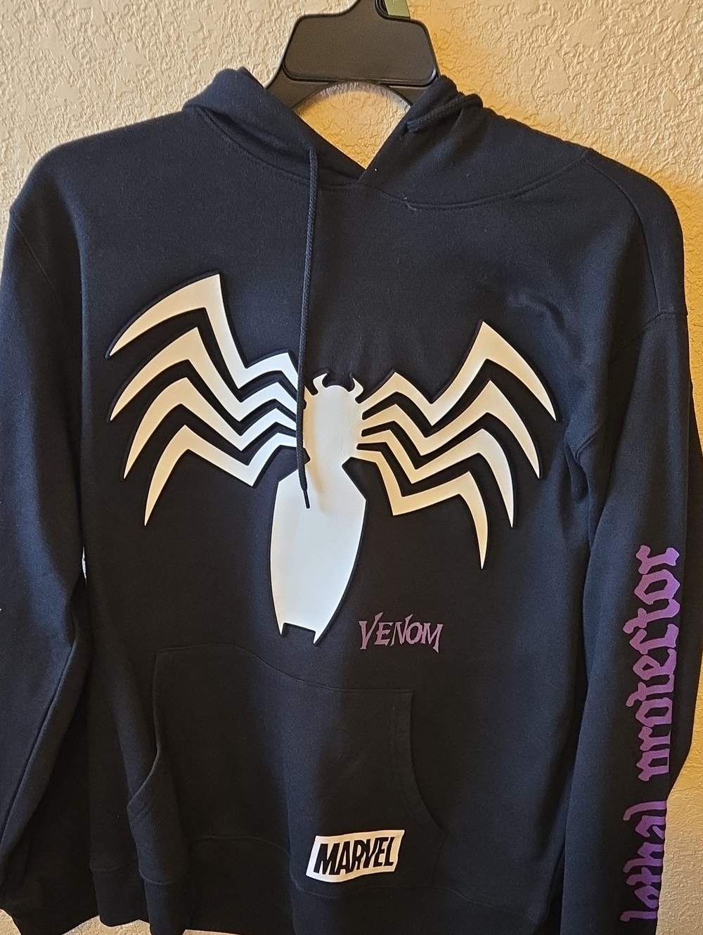 Marvel Venom Black Hoodie with White Spider Emblem and Purple Text